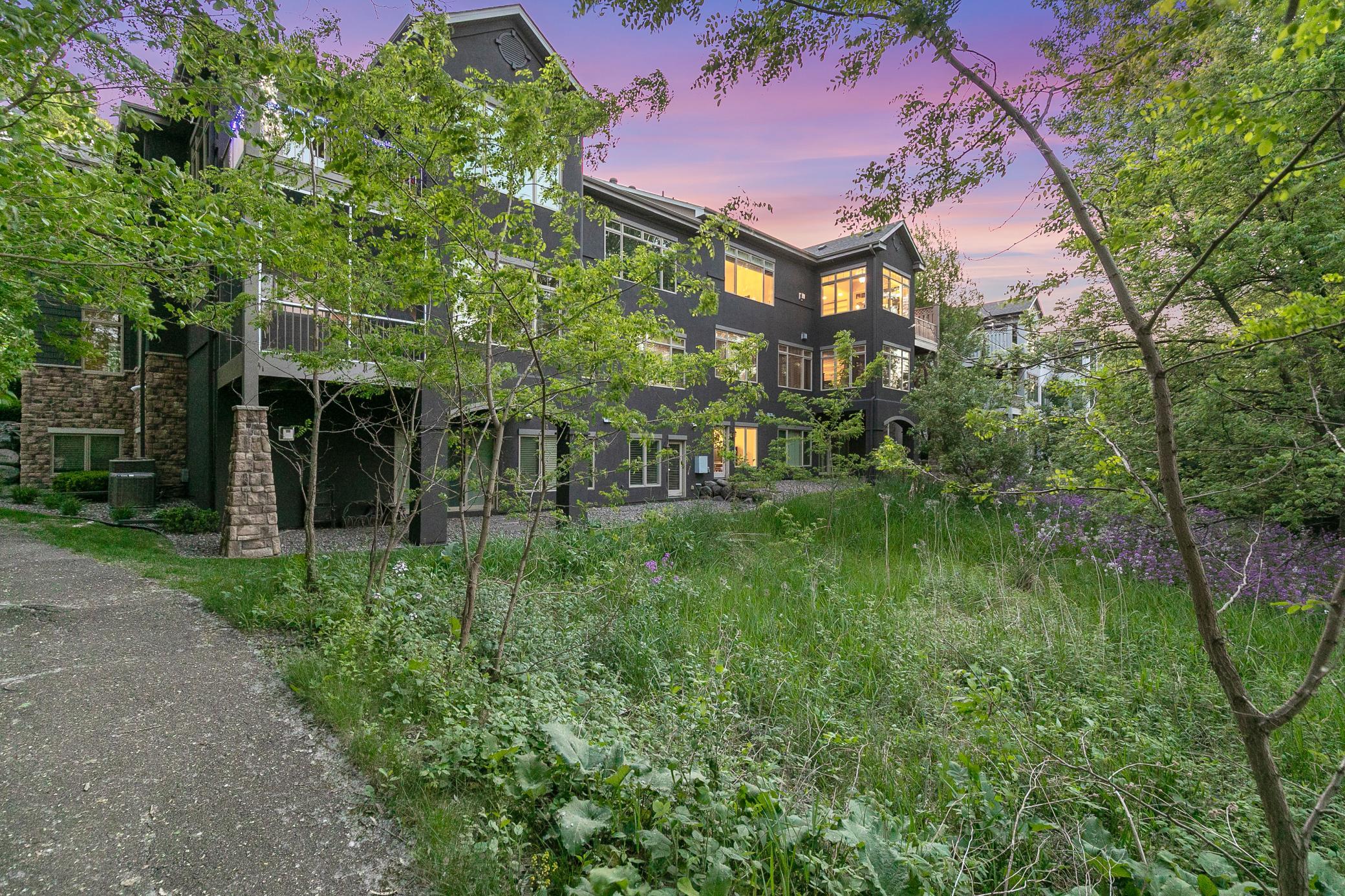 Enjoy privacy and nature views with a maturely wooded and vast protected wetland area behind the unit.