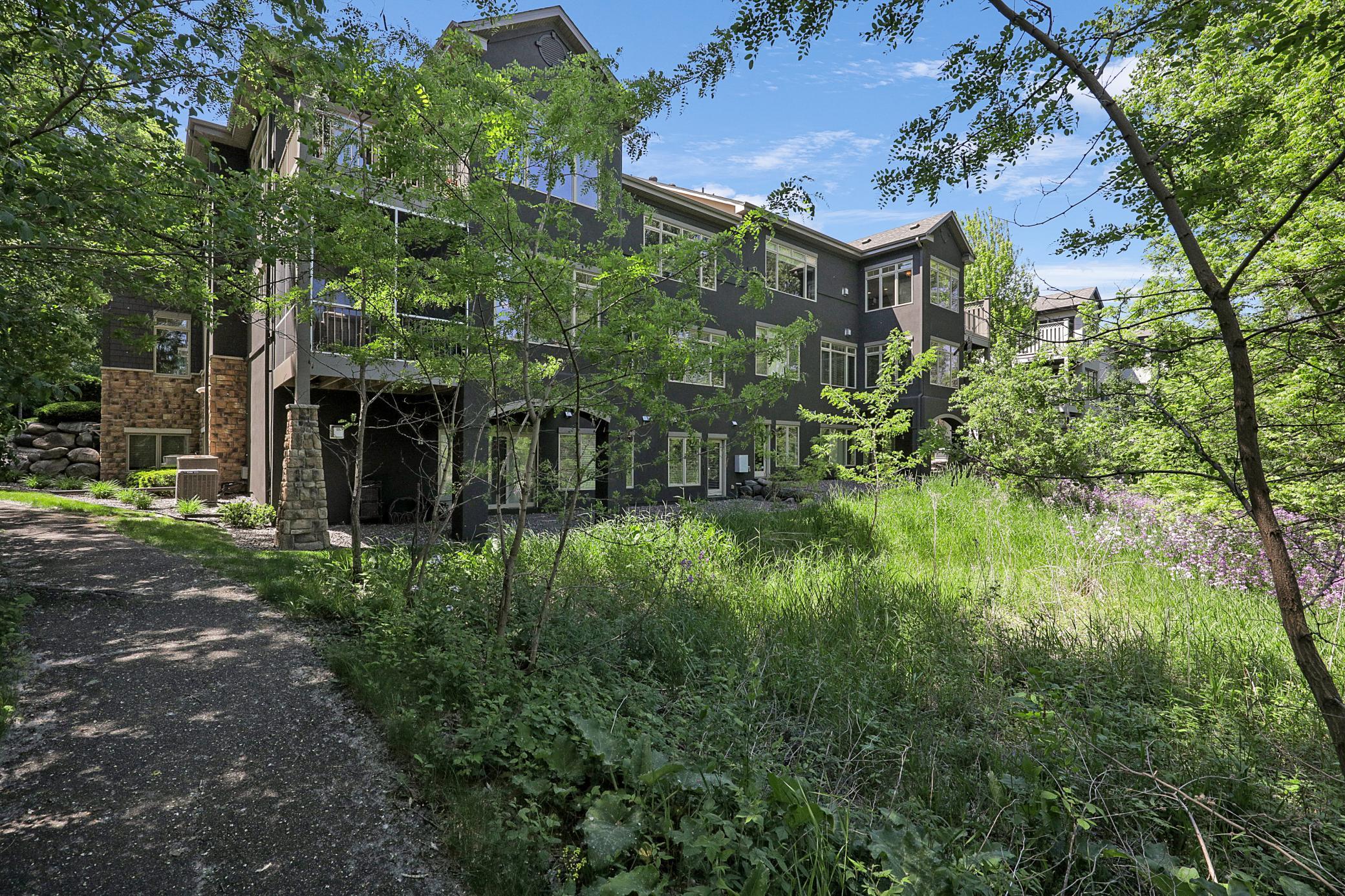 The backyard provides serene views overlooking the maturely wooded and vast, protected wetland area.
