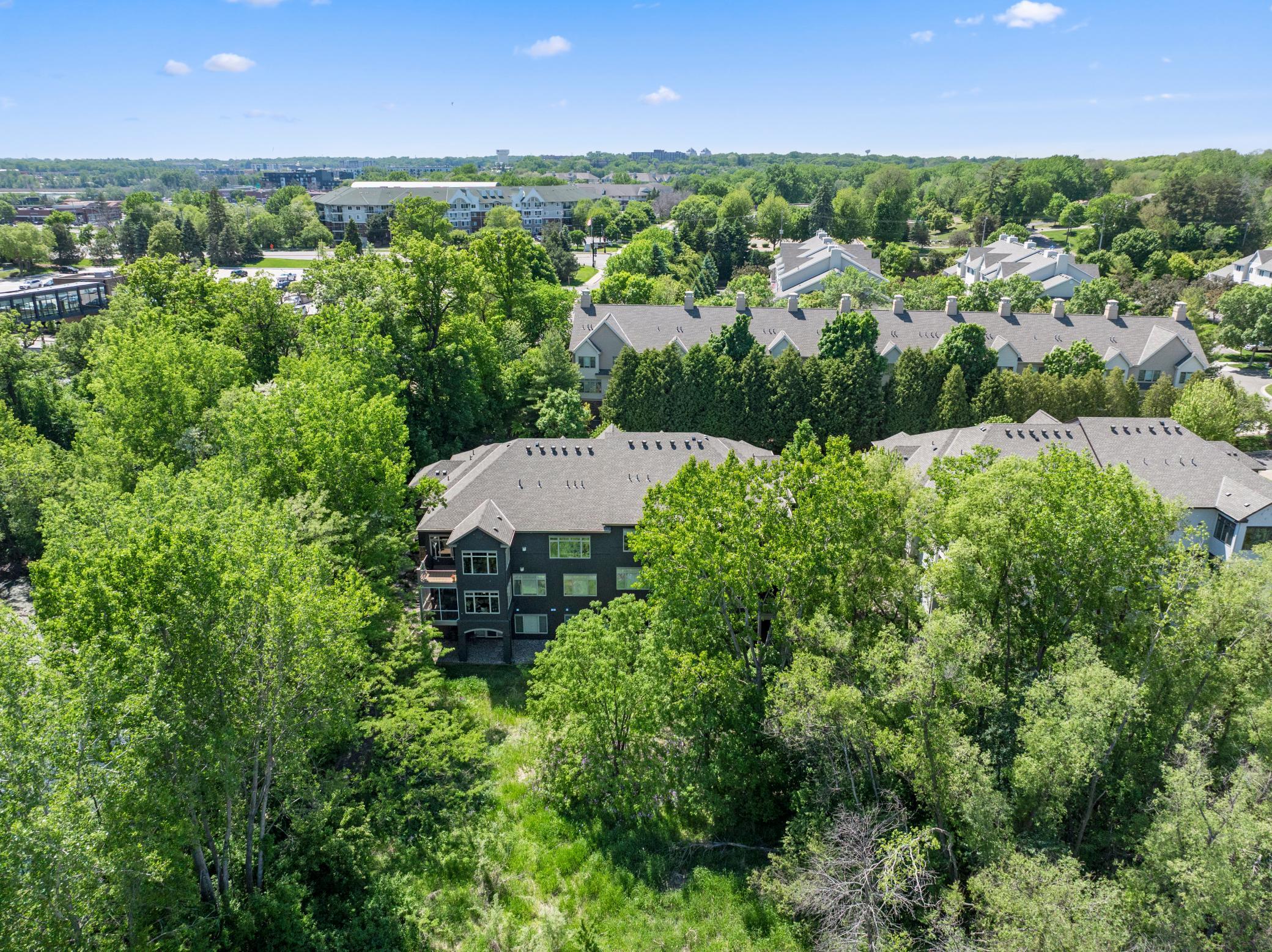 Well maintained landscaping provides a mostly flat area for yard games and entertainment.