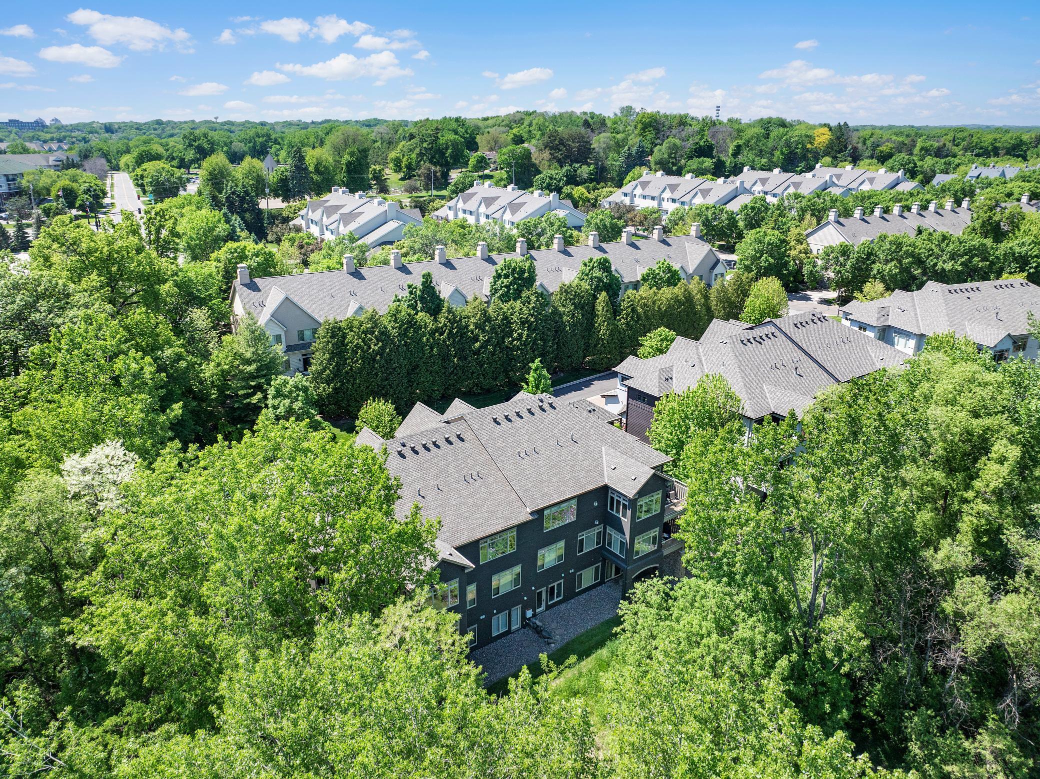 Well maintained landscaping provides a mostly flat area for yard games and entertainment.