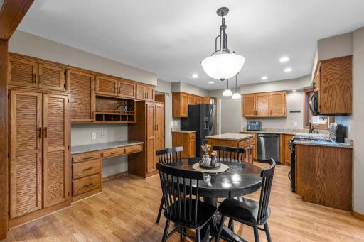 Tons of cabinetry, desk area and convenient informal dining nook.