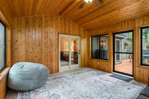 3 season porch offers vaulted ceiling and beautiful pine walls.