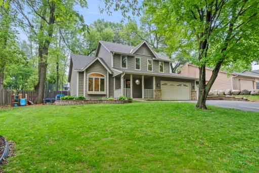 Amazing yard with beautiful mature trees and welcome front porch.