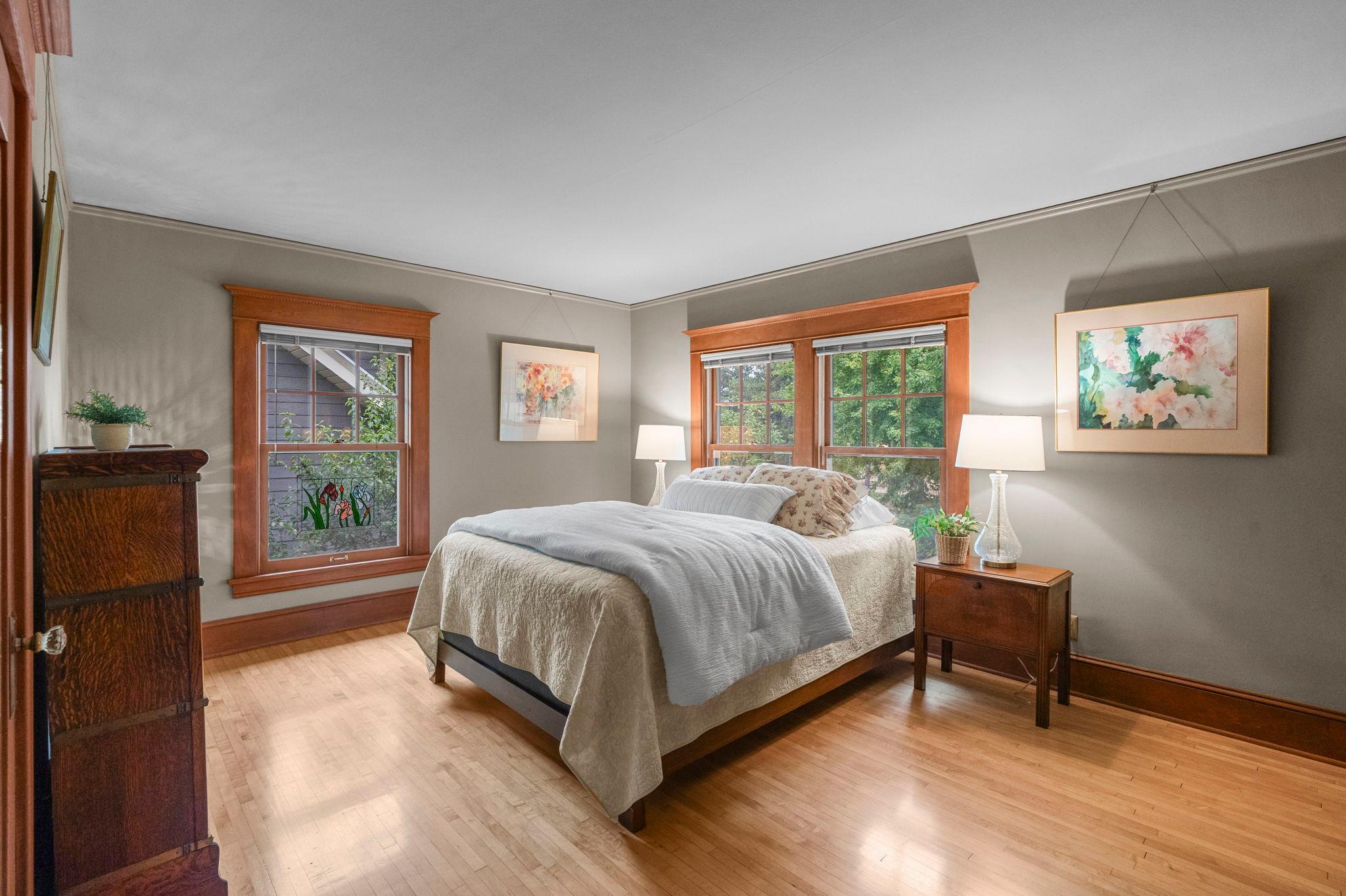 The first of three bedrooms on one level. Beautifully maintained hardwood floors.