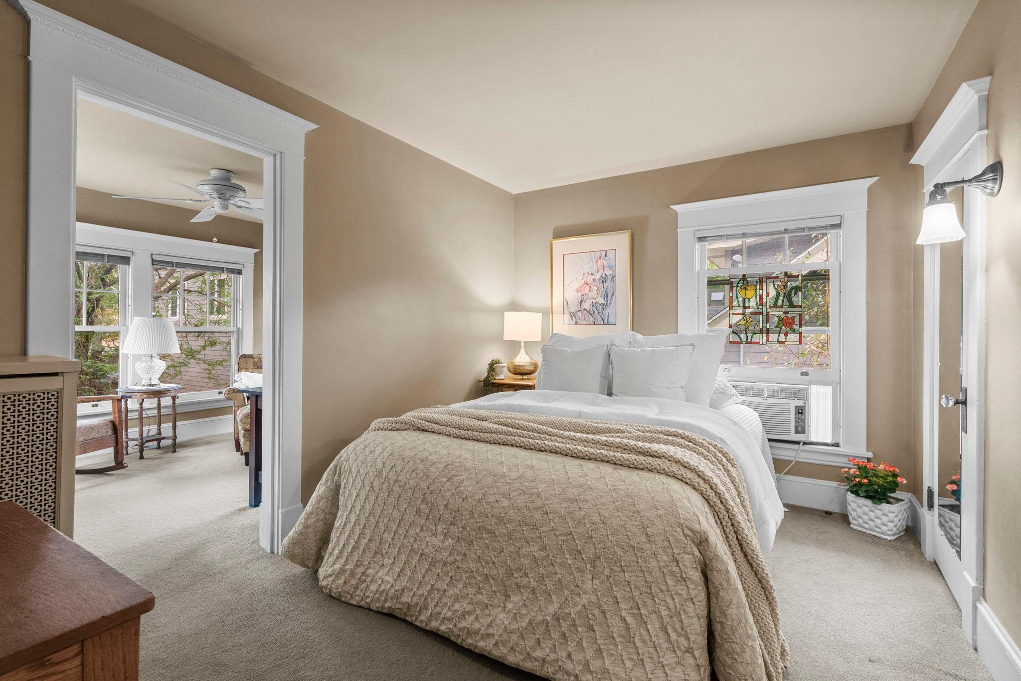 A second bedroom with an adjoining room.