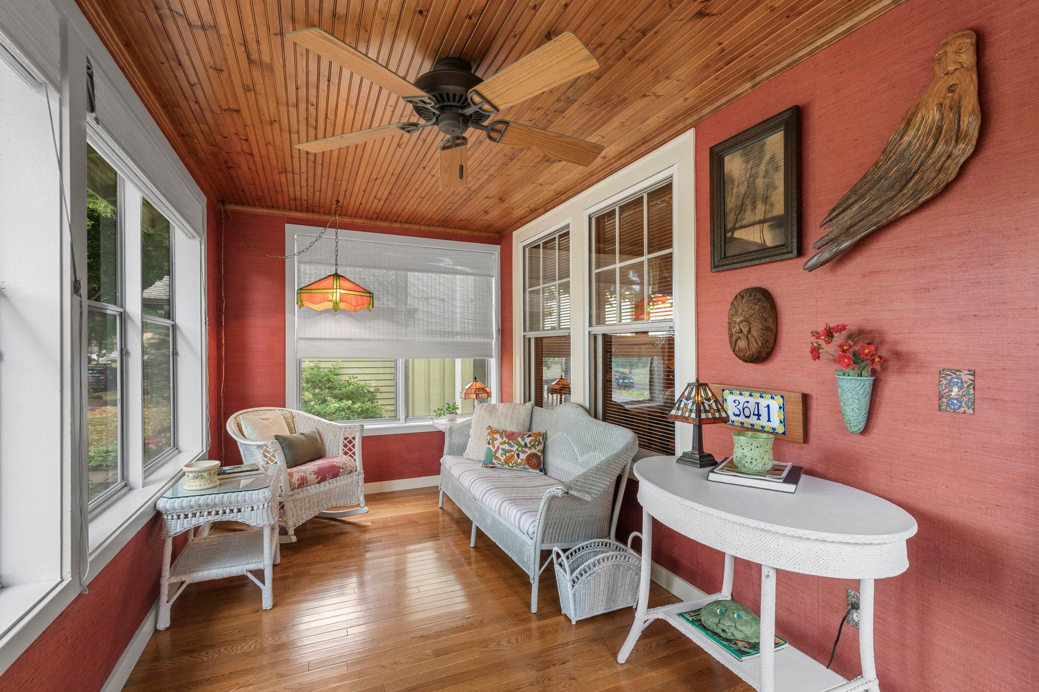 This fully restored front porch welcomes in the summer breeze and is perfect for morning coffee or settling in with a good book.