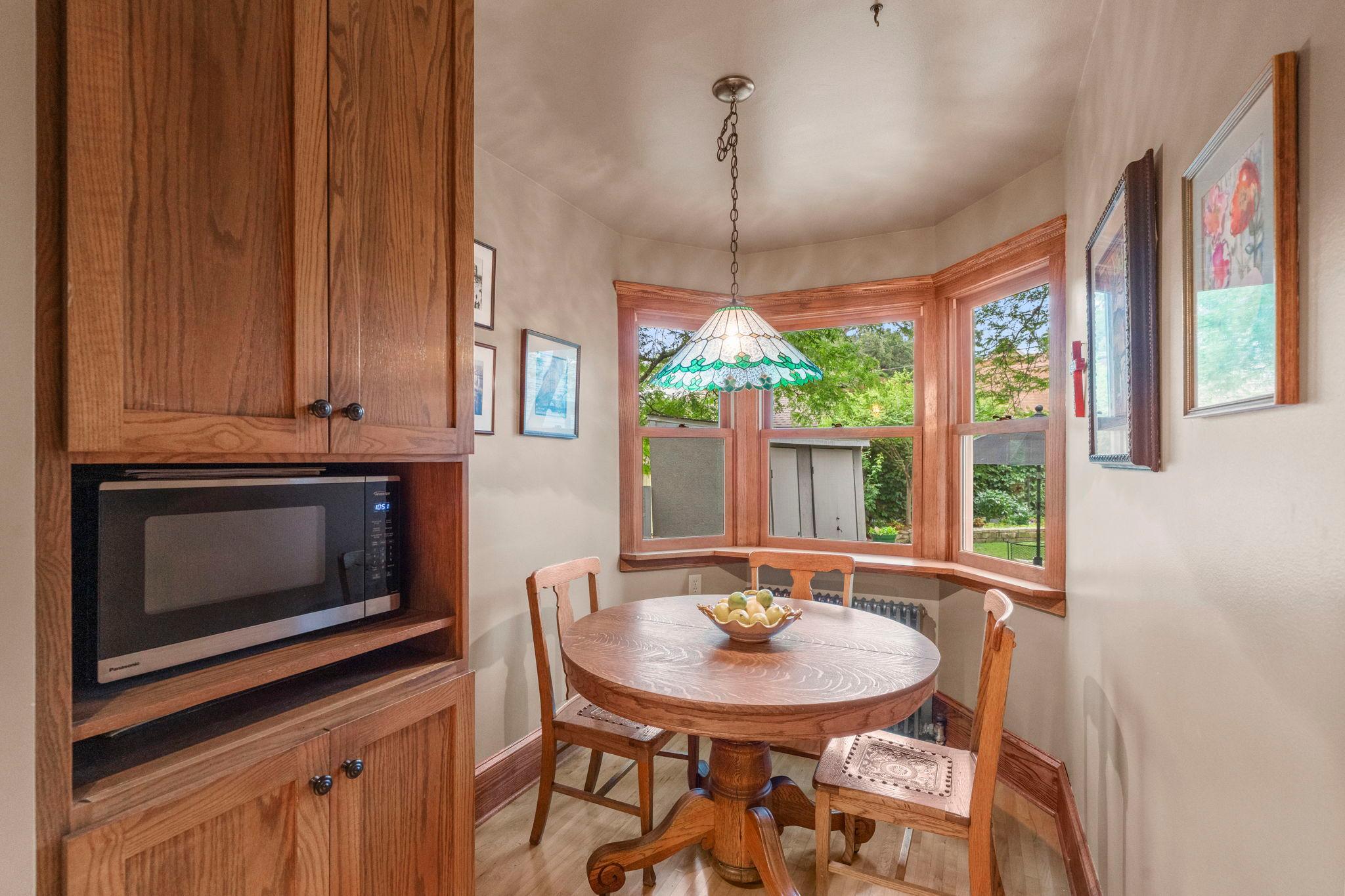 The kitchen alcove is perfect for casual meals and enjoying views of the back garden.