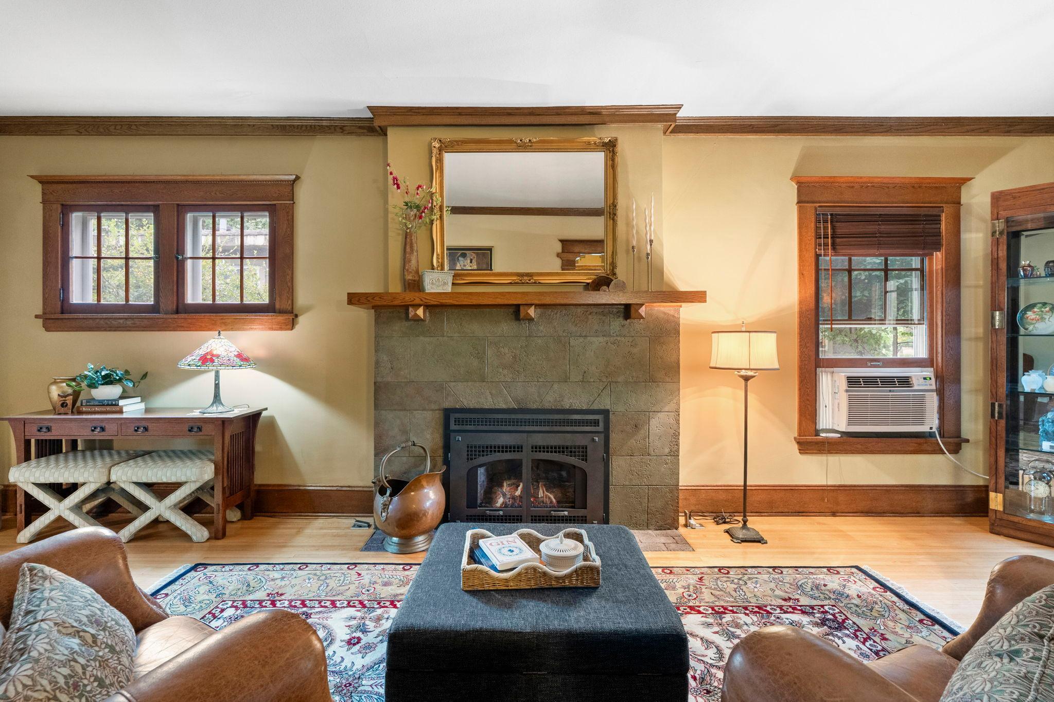 The original fireplace facade has been restored and a gas insert installed. Perfect for enjoying winter evenings.