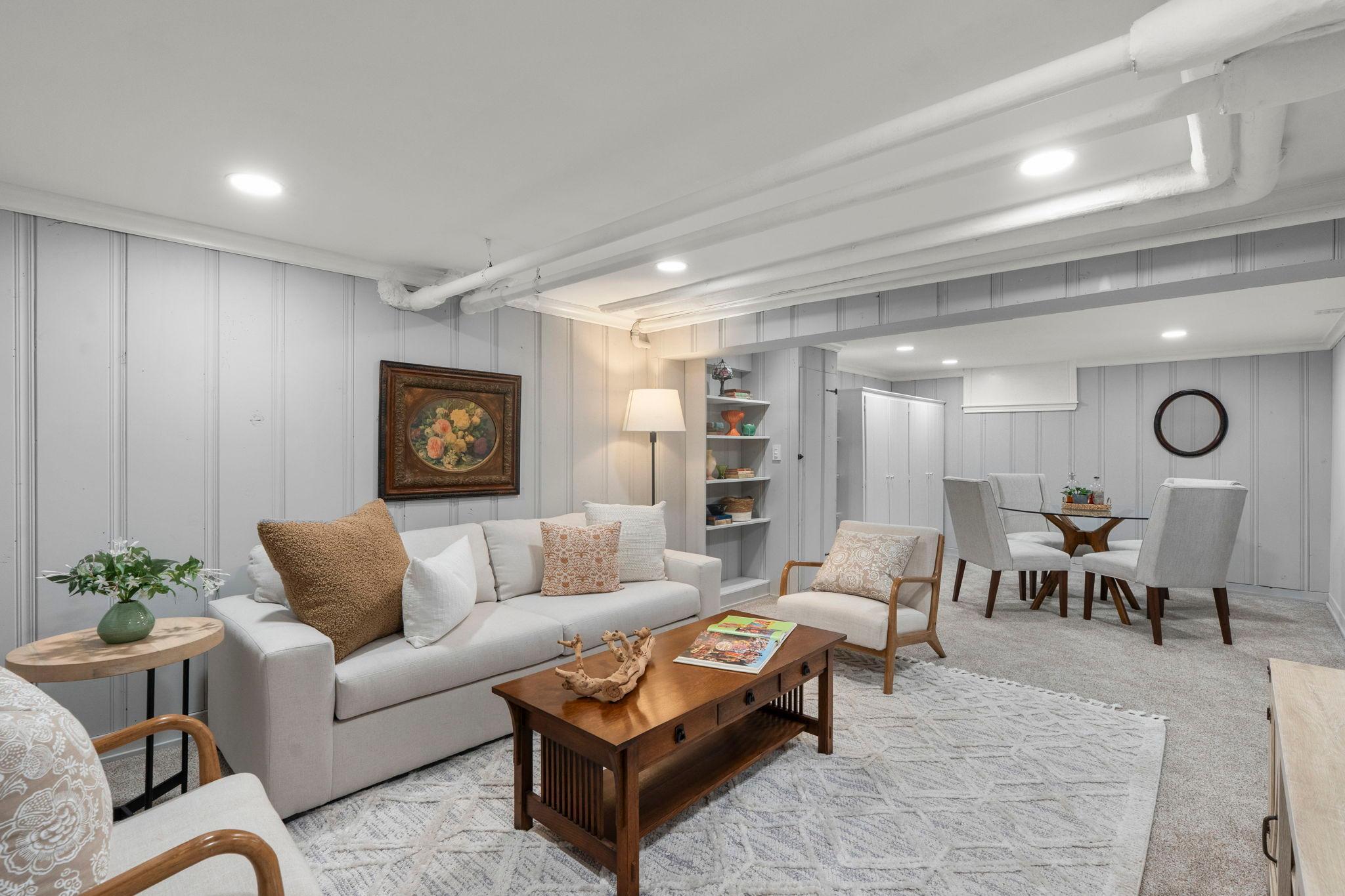 This recently updated lower level family room offers a versatile space to watch television, play games or create a dedicated home office space.