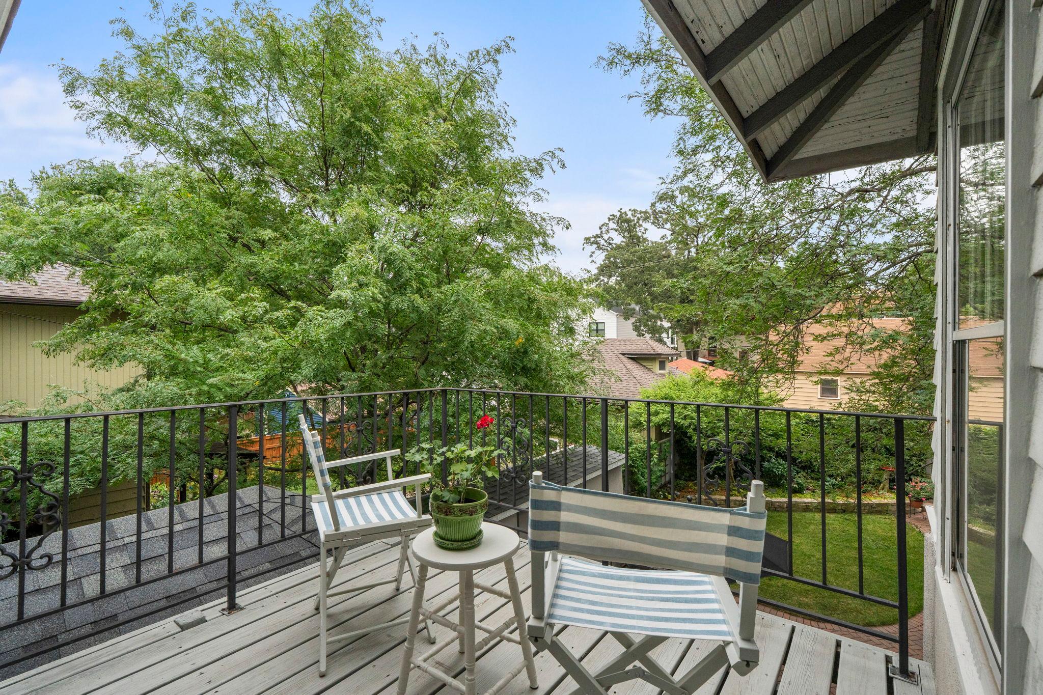 The balcony overlooks the backyard.