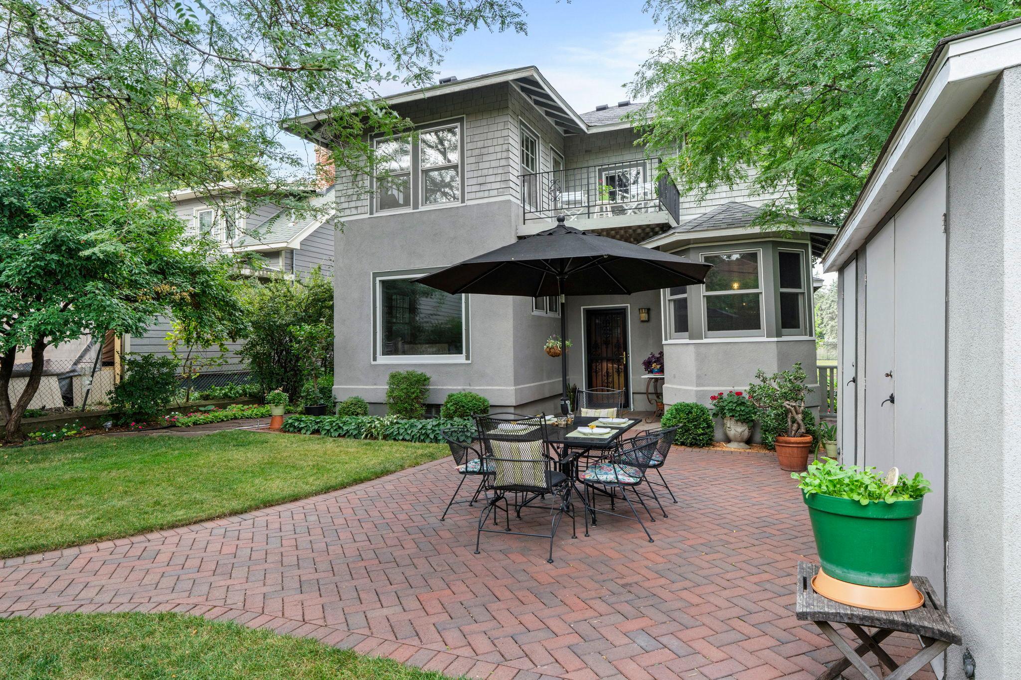 The paver patio is perfect for entertaining and the large outdoor storage structure provides added privacy and storage space for garden supplies and yard tools.