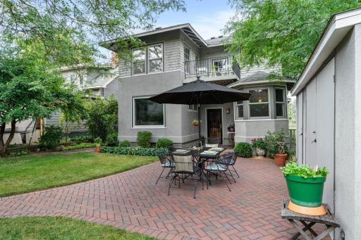 The paver patio is perfect for entertaining and the large outdoor storage structure provides added privacy and storage space for garden supplies and yard tools.