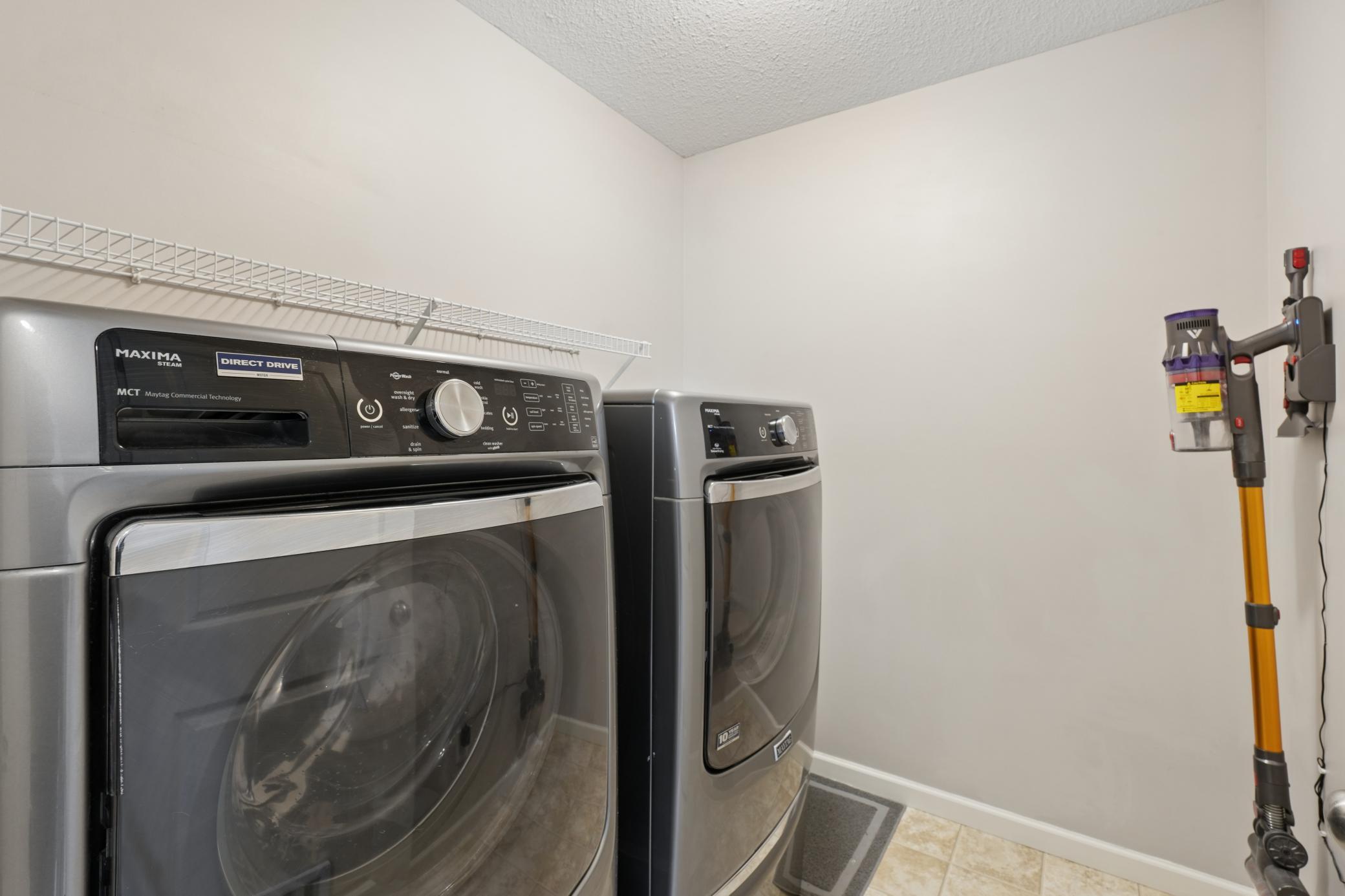 Laundry room with front loading washer / dryer conveniently located on the upper level