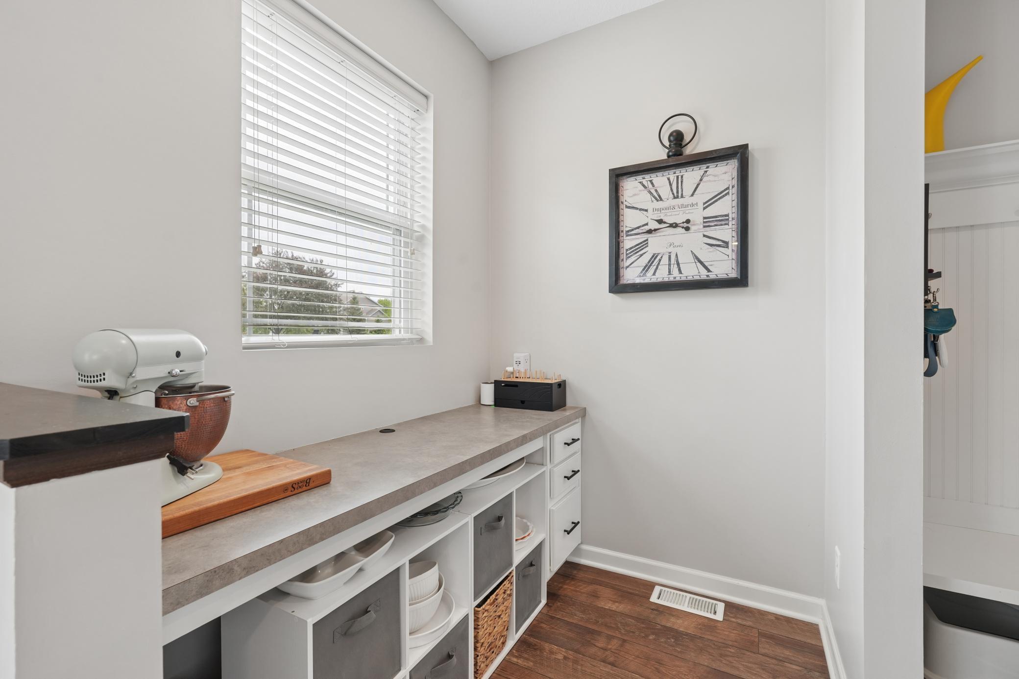 Hobby area with built in shelves and drawers helps to keep you organized.