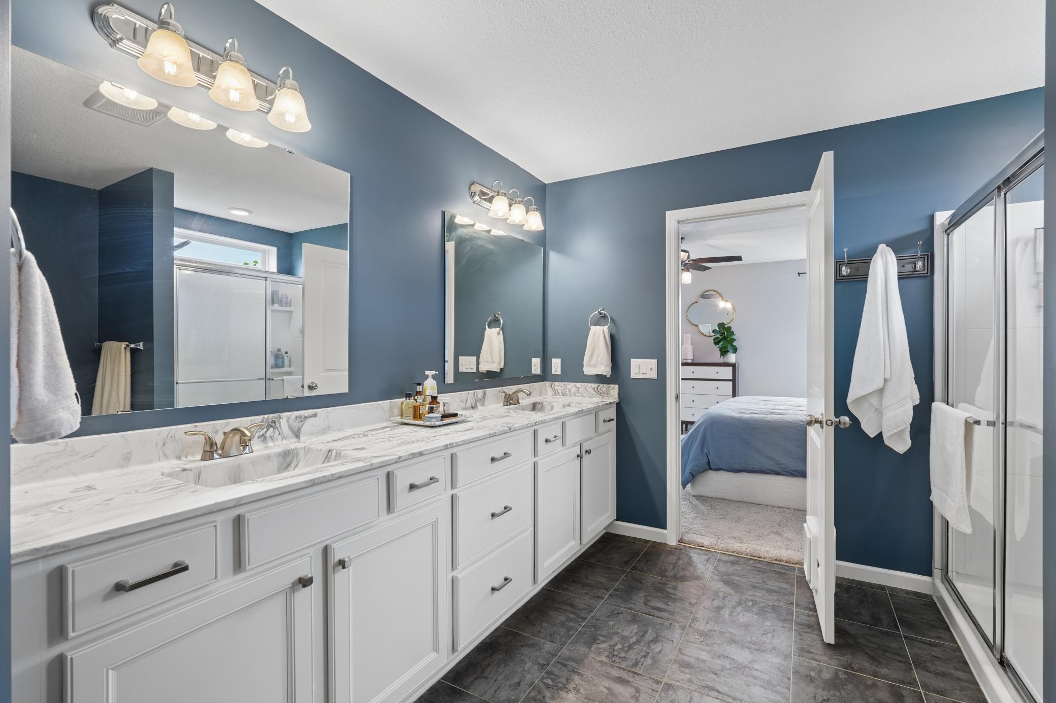 Private primary bathroom with double bowl sink