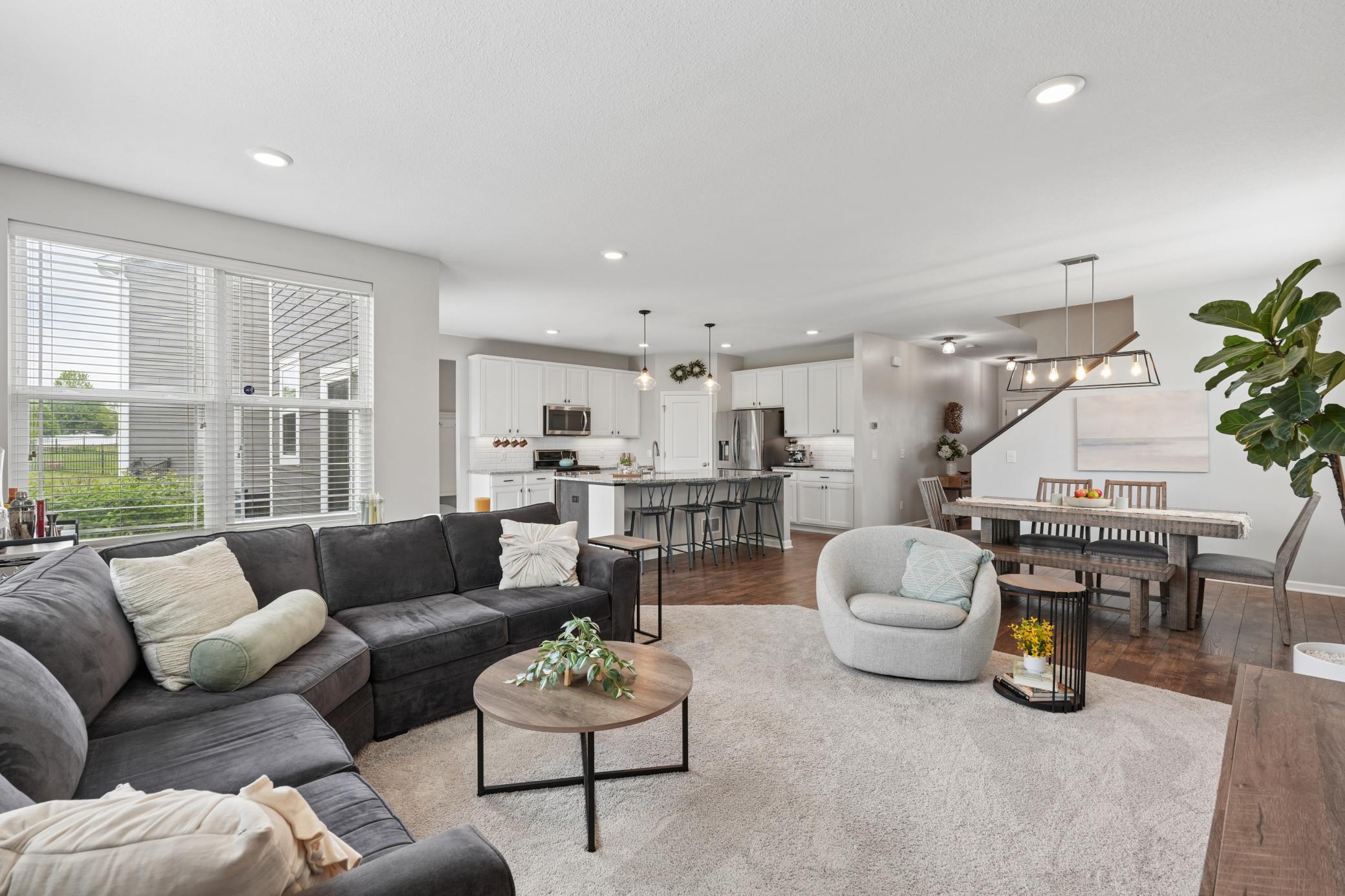 Main level open floor plan that naturally connects the kitchen, dining, and living areas