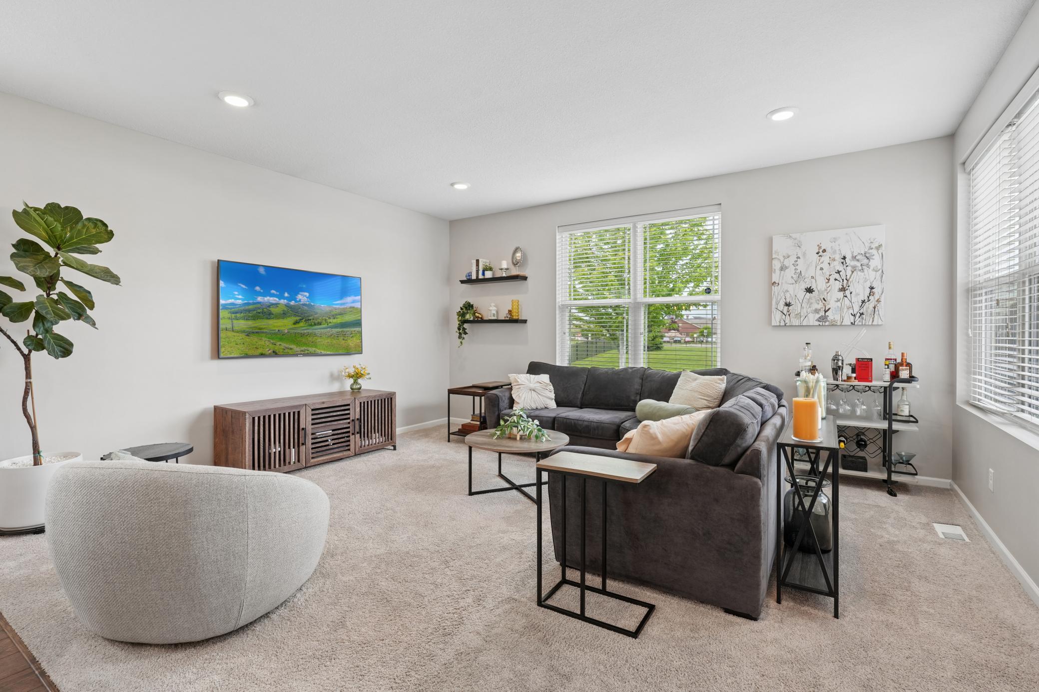Relax and take in a movie in your spacious main floor living room