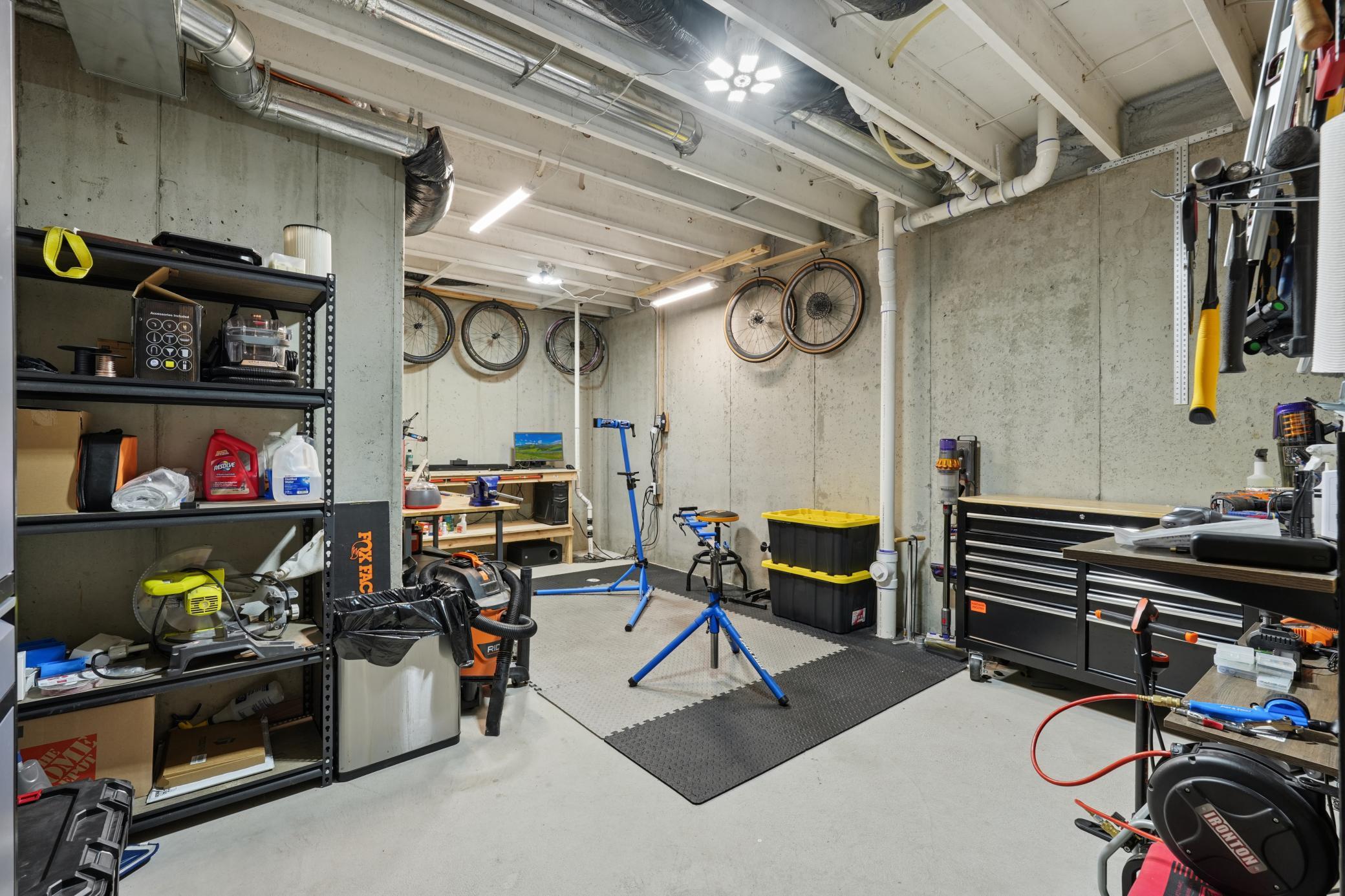 Unfinished lower level with plenty of space for a work area