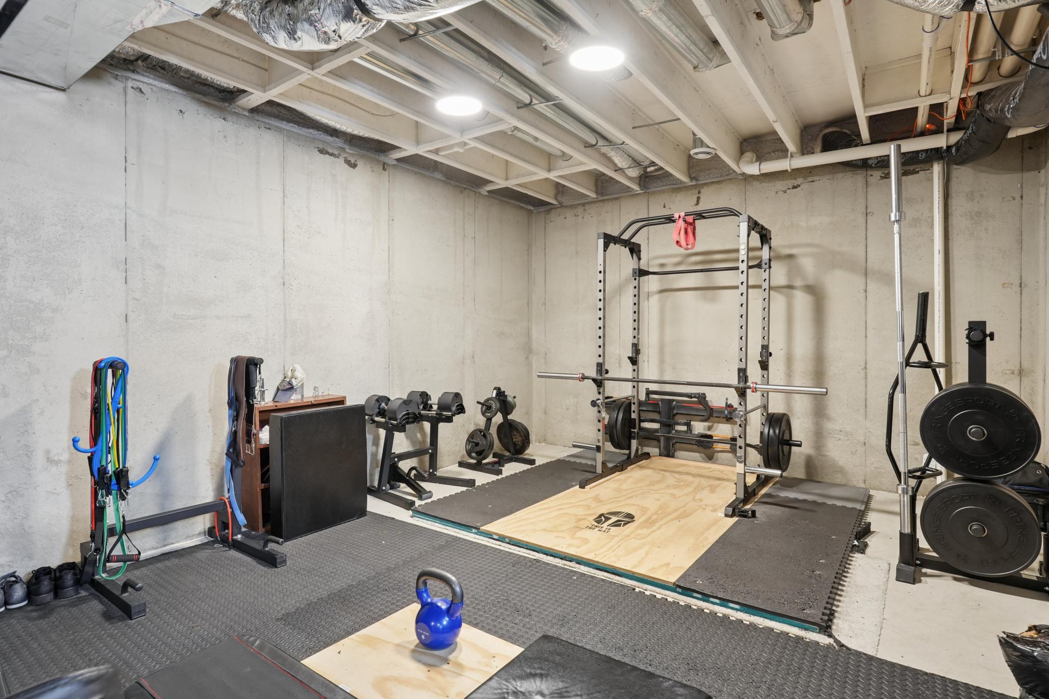 Unfinished lower level with plenty of space for an exercise area