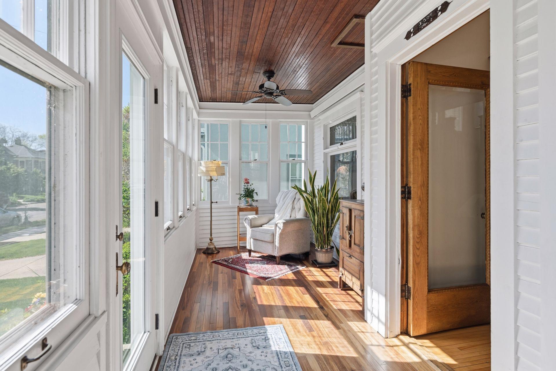 Enjoy the sunshine and vibrant neighborhood views from your four season porch!