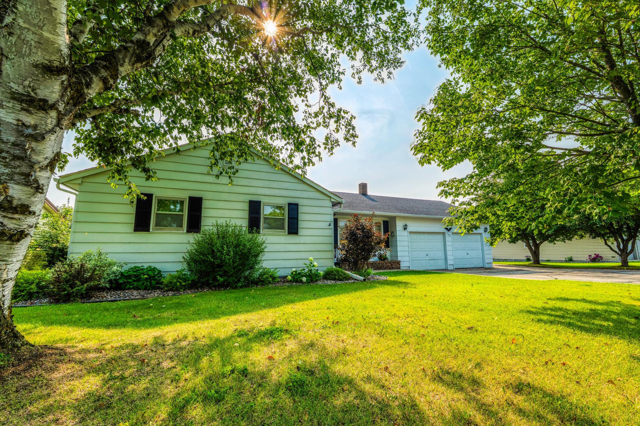 This classic rambler offers 2 double garages & lakeshore living