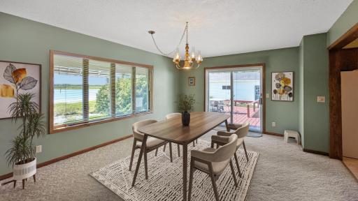 The large formal dining room offers views of the lake. Virtually Staged
