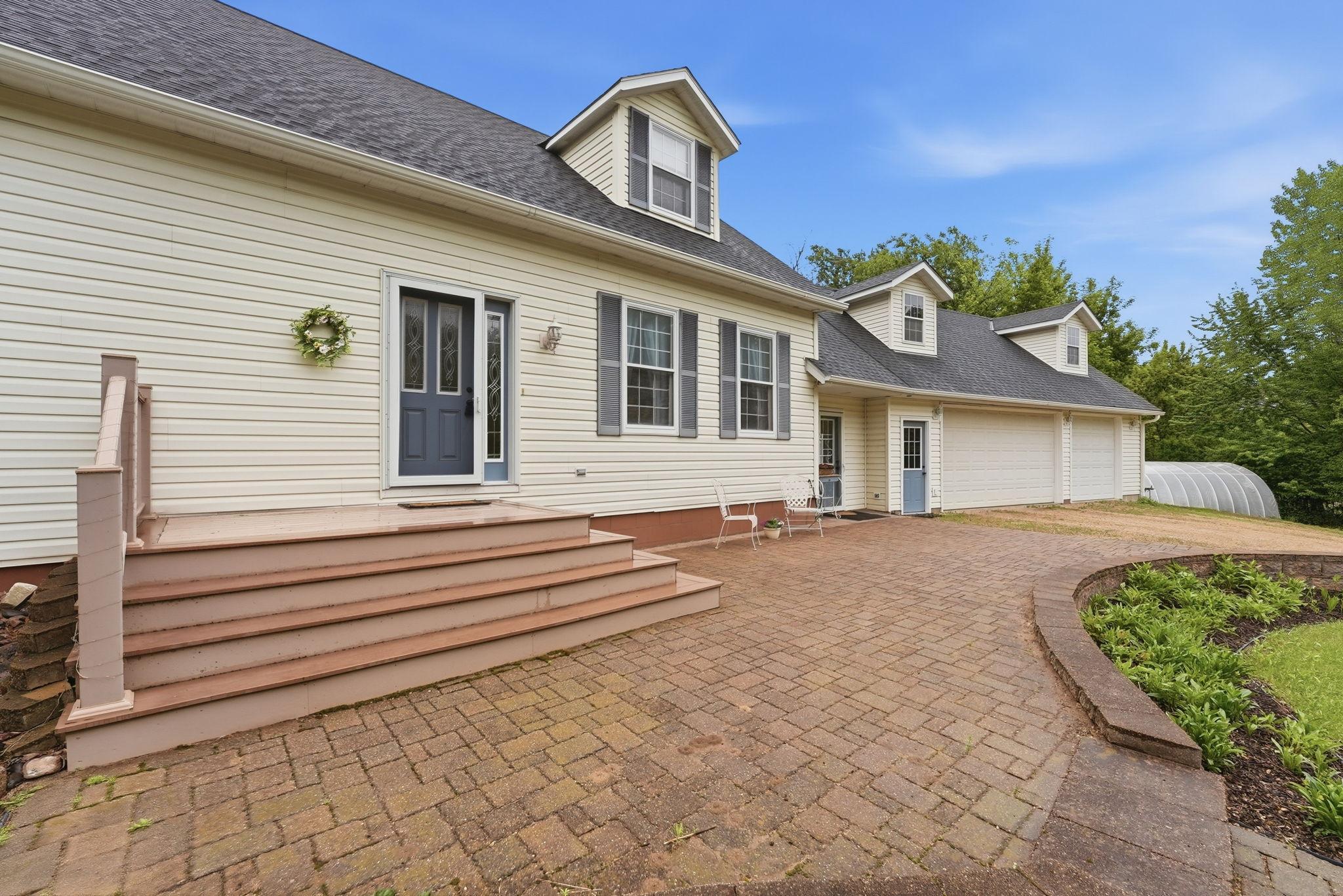 Front steps/deck and pavers.