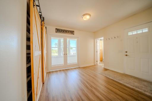 Side entry to main floor laundry space and bath
