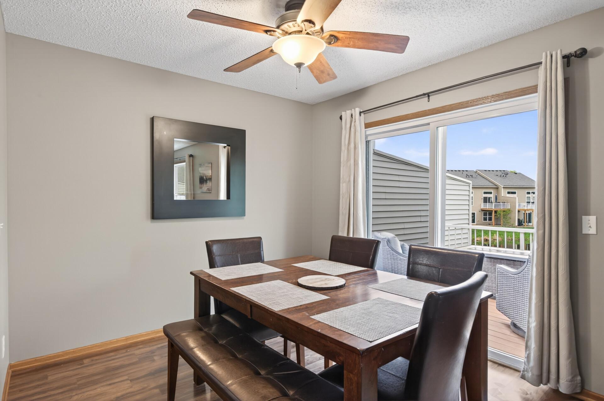 Dining room with door leading out to deck.