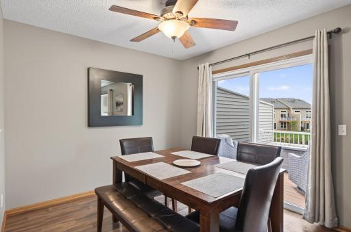 Dining room with door leading out to deck.