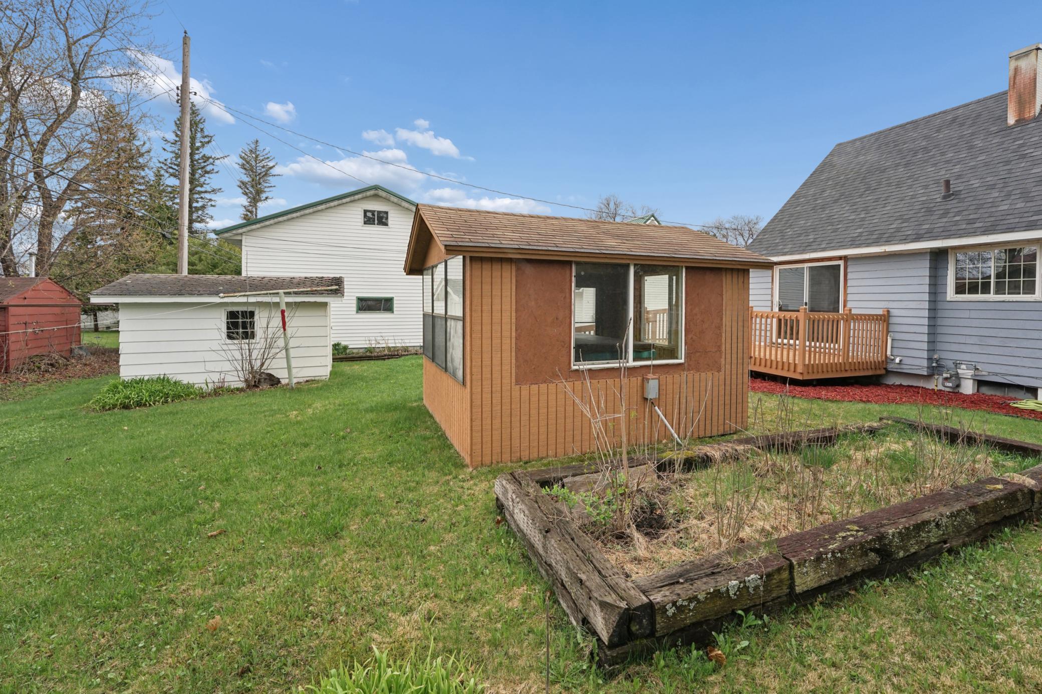 Additional outbuilding with electricity offers extra storage, workshop space, or endless potential for hobbies and projects. The building currently houses a hot tub/spa, which was recently turned on and is running, though no water has been added.