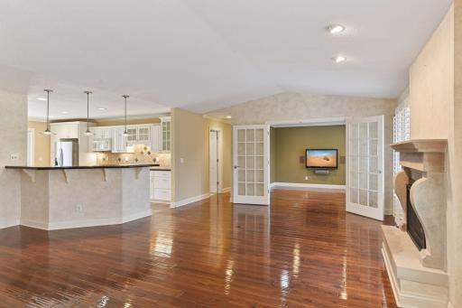 The view of access from living room to den and kitchen.