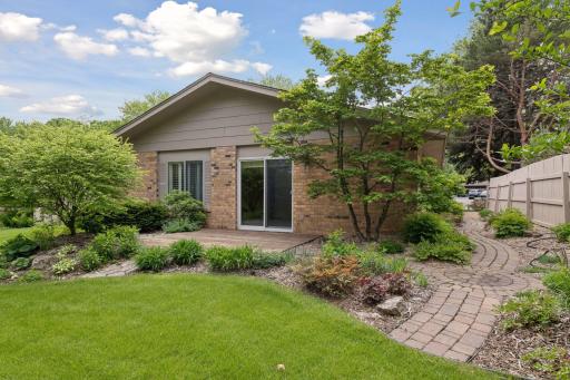 This home is surrounded by perennial gardens, two patios and paver walkways.