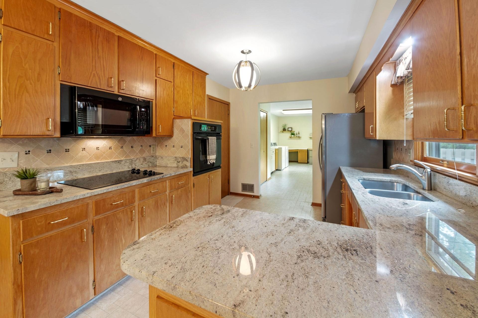 Granite countertops & tile backsplash.