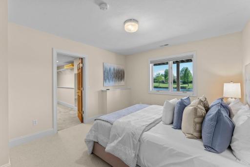 Another perspective of the fifth bedroom, showcasing the entrance to the expansive walk-in closet.