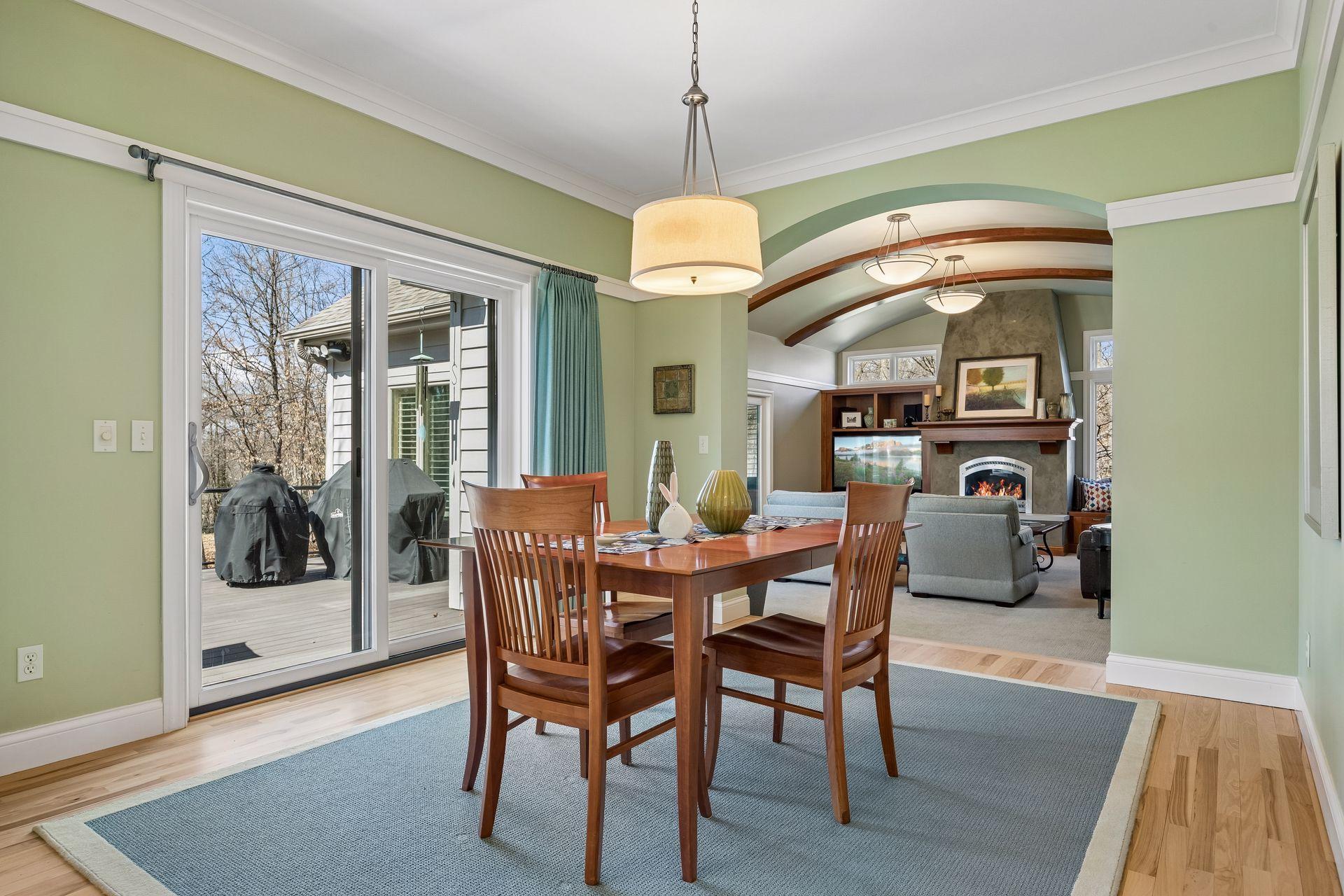 Very open concept on the main level with the flow from the dining area to the living space. Also deck access here. Grill can stay with the house!