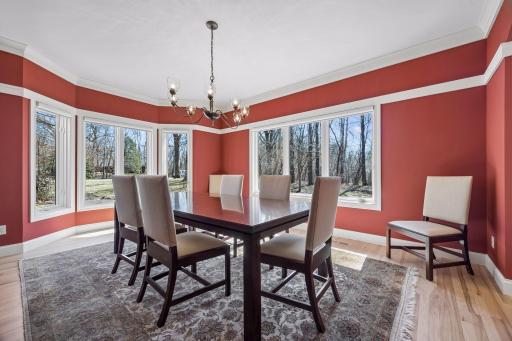 Another angle of the formal dining room that is boasted by sunlight.