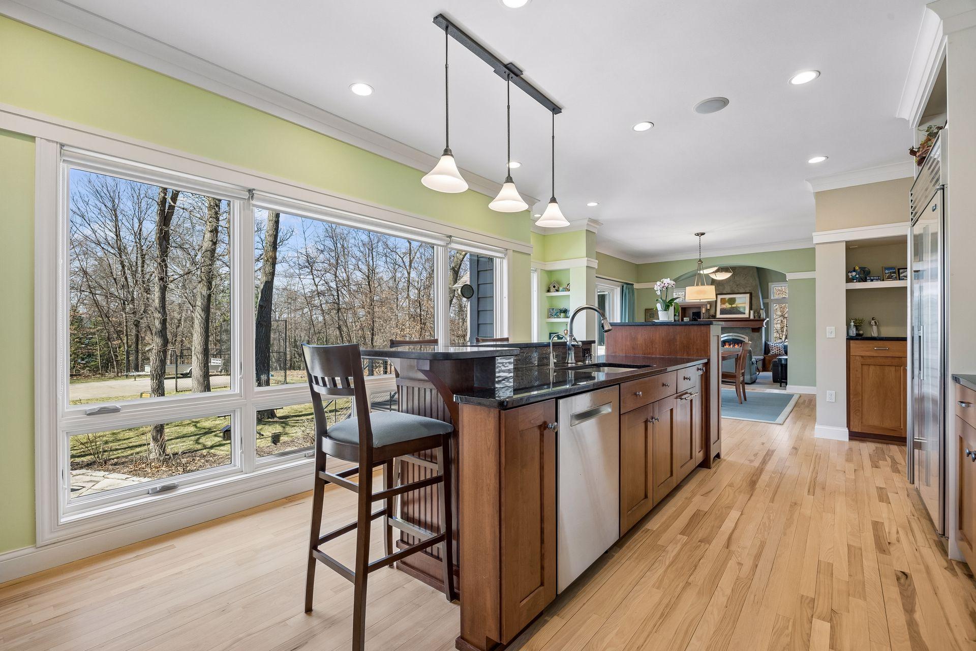 Main floor open flow from kitchen to dining area, to the living space to porch and access to the deck! Beautiful floor plan.