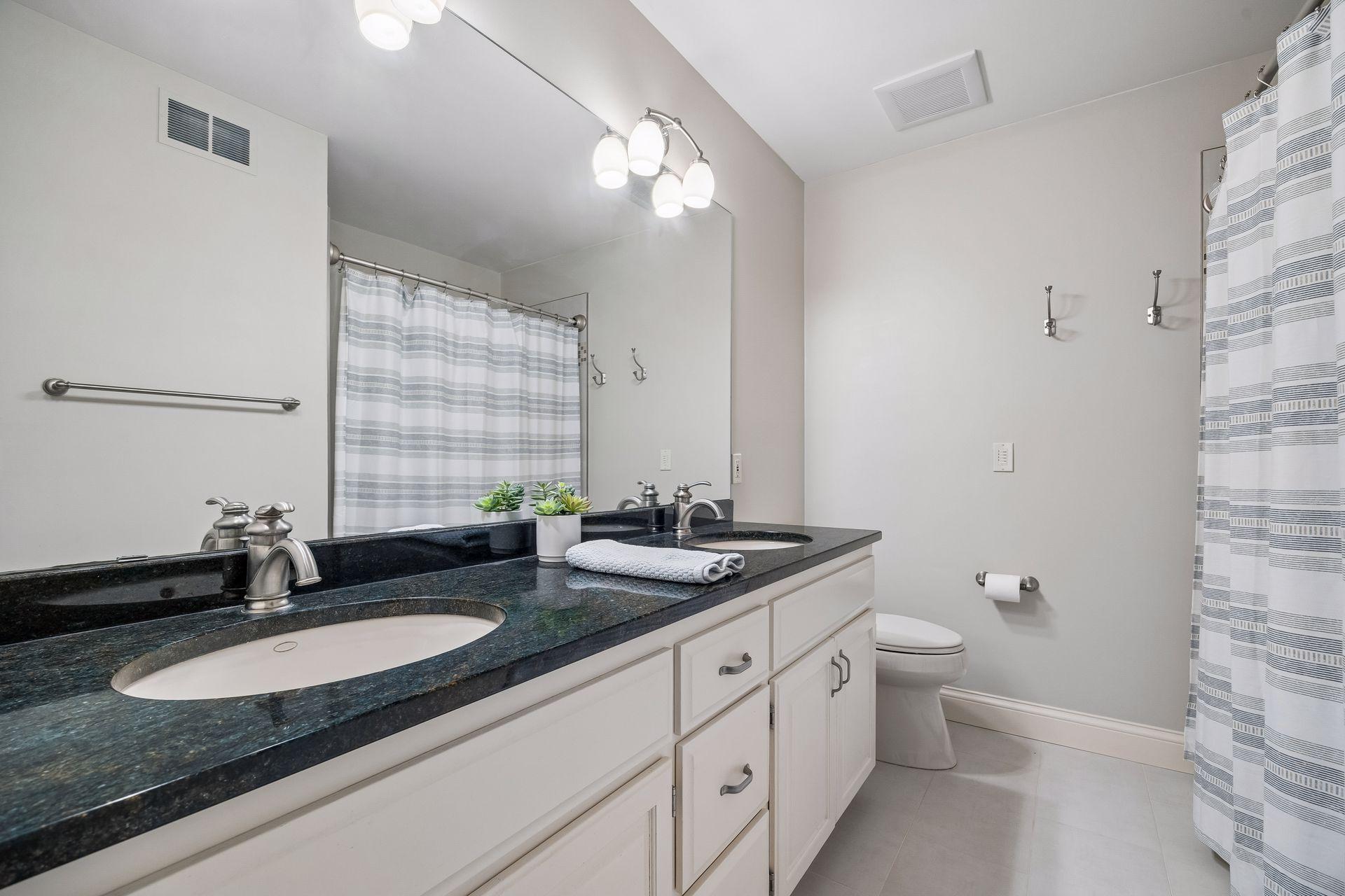 Double sink in the upper bathroom as well. Great vanity storage.