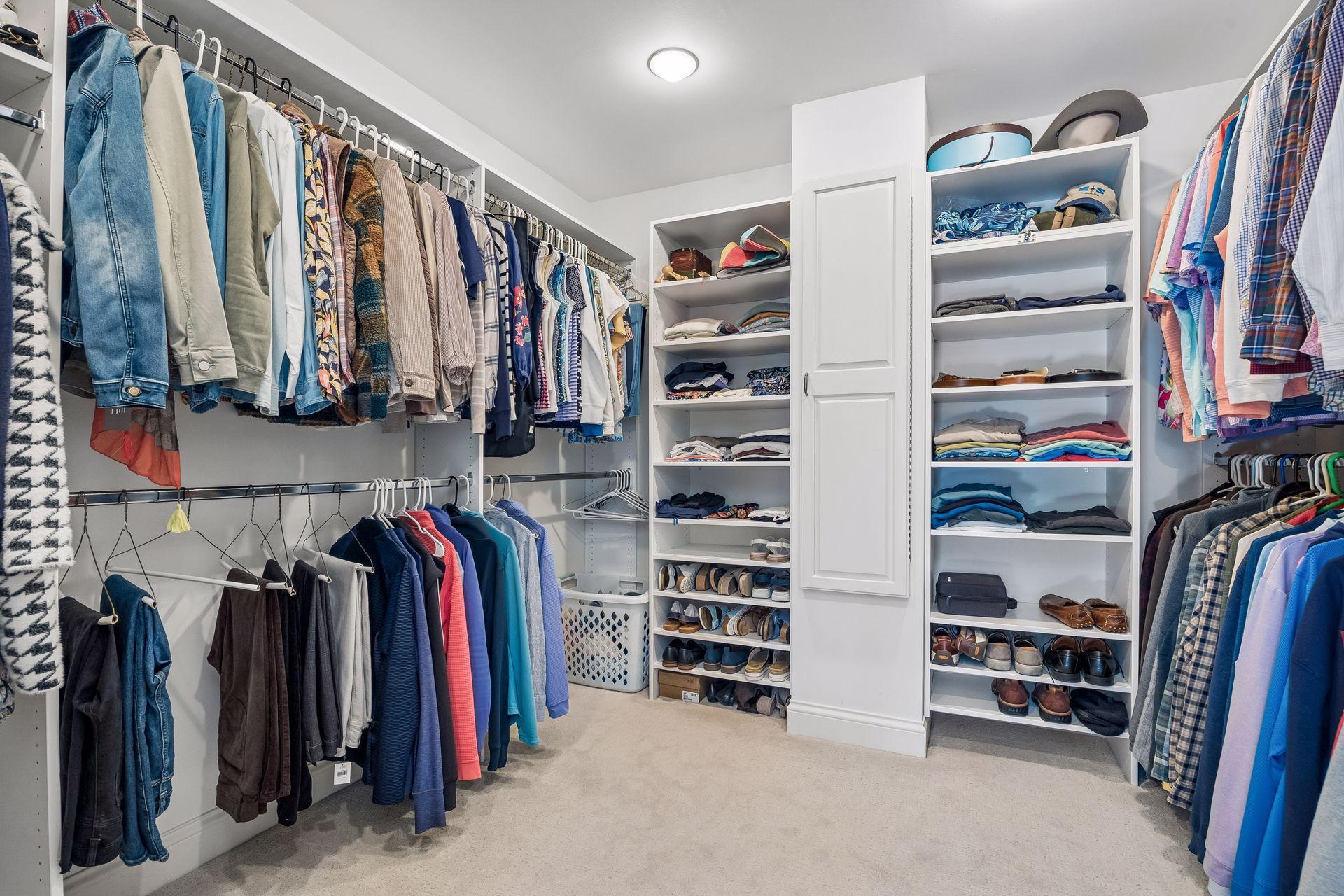 Large custom primary closet with convenient built ins. Plenty of space!