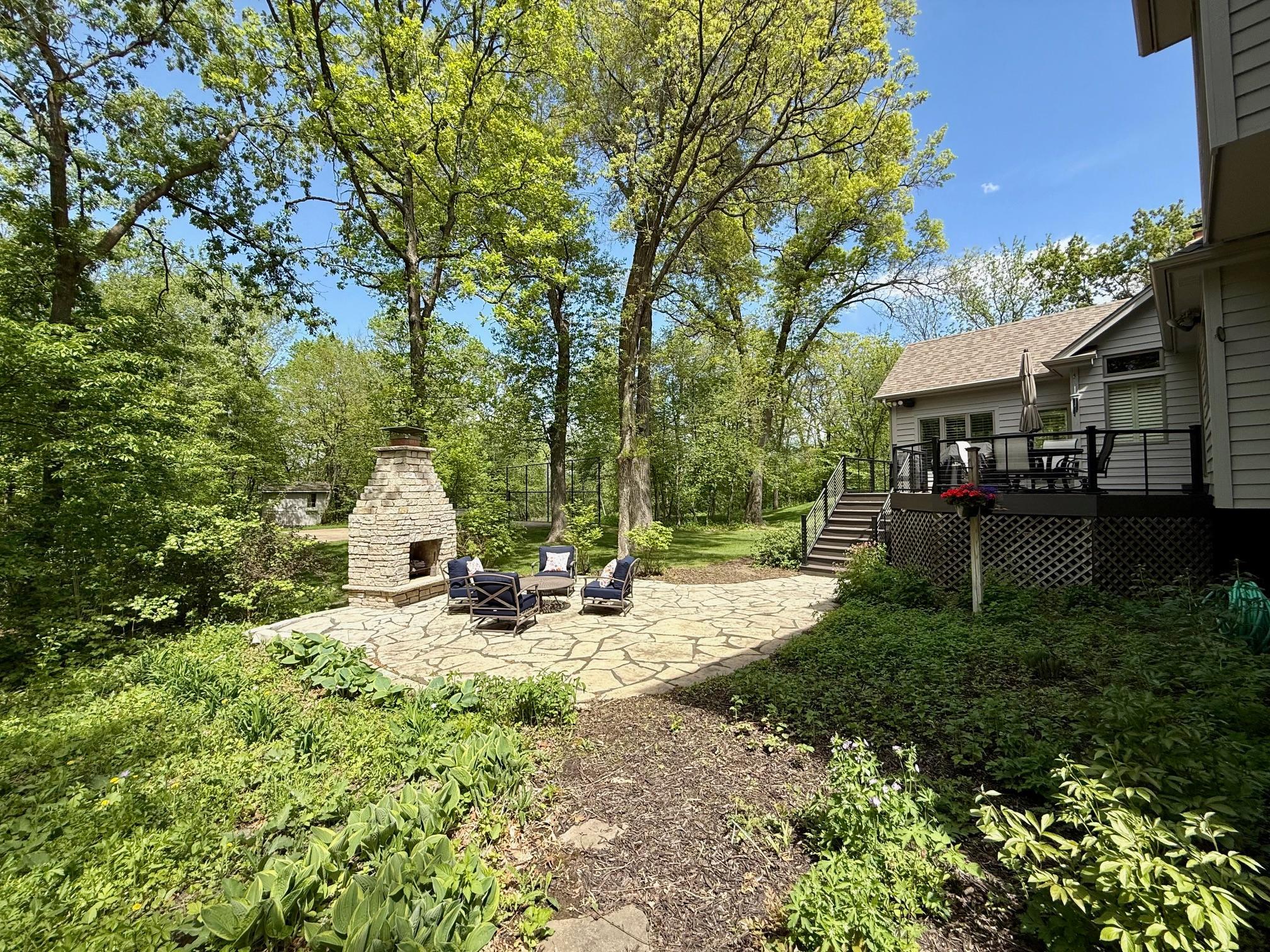 Another angle of the outdoor fireplace and the deck.