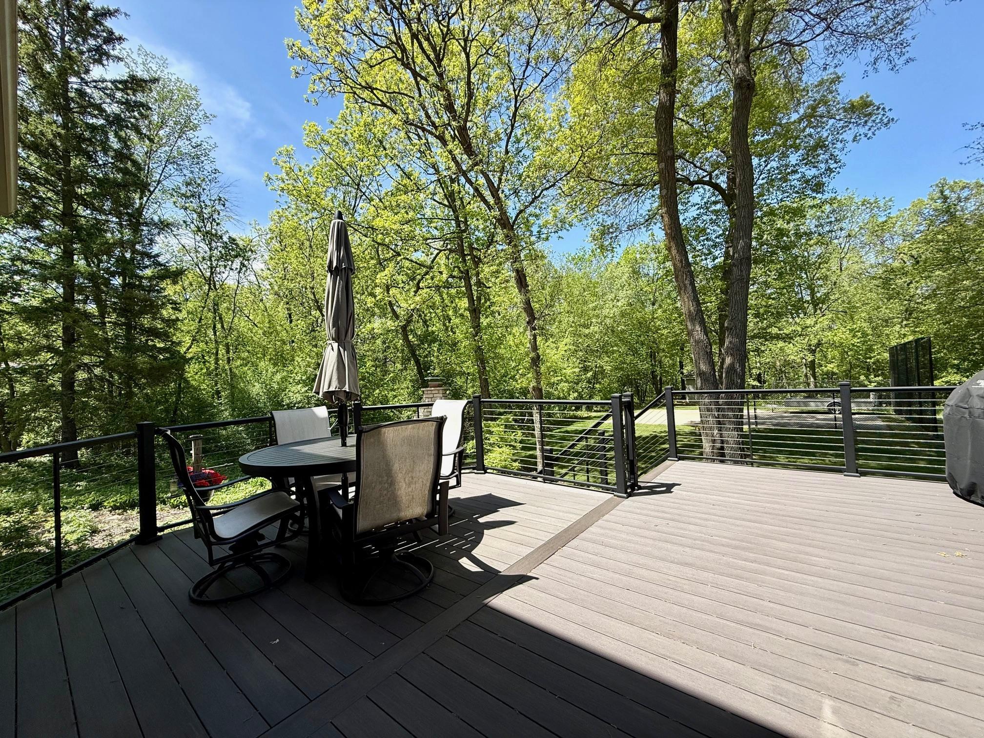 Both the informal dining area and porch walk out to the fabulous rear deck with glass rails!
