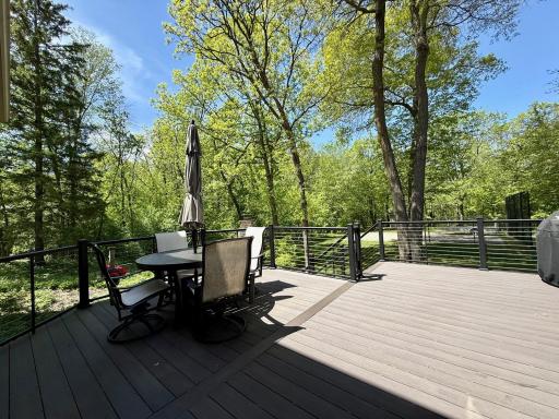 Both the informal dining area and porch walk out to the fabulous rear deck with glass rails!