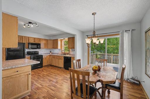 Kitchen and diningroom are spacious, well lit, and overlook the deck and fairytale style backyard!