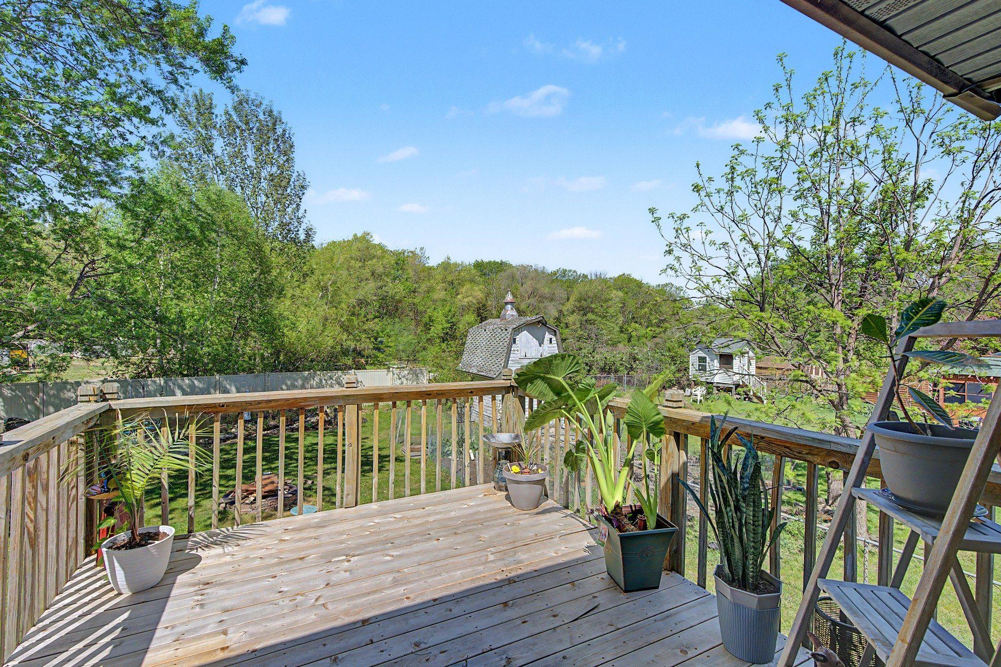 Enjoy the view of your garden (already planted with veggies for your summer dining) and huge fully fenced backyard complete with a waterfall, pond, mature shade trees, and shed