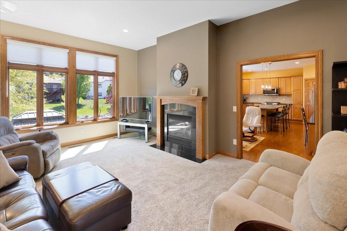 Cozy Great Room overlooking spacious backyard, and see-thru fireplace to Hearth room