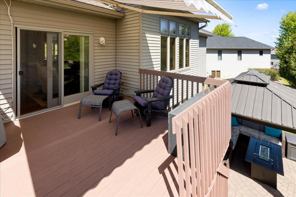 Maintenance-free Deck with awning; walks down to paver patio