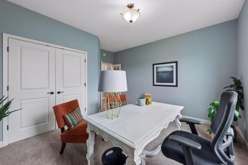 Main floor bedroom/flex room with large closet can be used as office, playroom, craft room or exercise room.