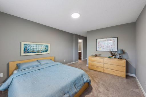 This bedroom features a private en-suite bathroom.