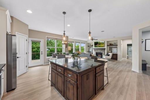 Seamless flow into the informal dining area leading out to the deck and main floor dining room.